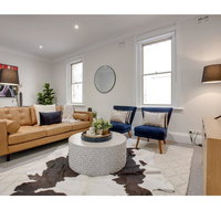 Large stylish and quiet penthouse steps from surf - Getaway Accommodation