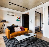 Artsy Apartment CBD City Views and Balcony - Getaway Accommodation